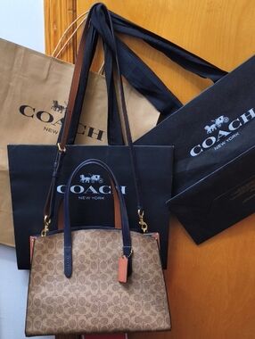 Coach Charlie Carryall In Signature Canvas No. 69481